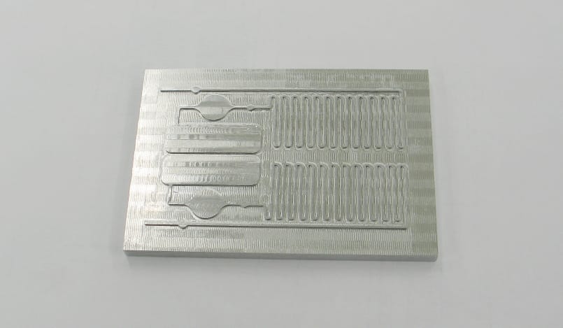 Manufacture of moulds for the production of disposable microfluidic cartridges